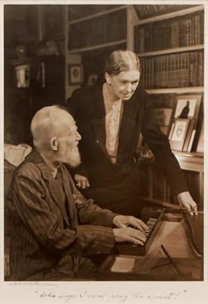 Seller image for Portrait of Shaw playing the spinet with Blanche Patch, his secretary, looking on. for sale by Peter Harrington.  ABA/ ILAB.