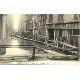 Bild des Verkufers fr Carte Postale Ancienne - 65 - Innondations Paris ( Janvier 1910). - Les passages rue des Ursins. zum Verkauf von JOIE DE LIRE