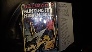 Seller image for The Hardy Boys: Hunting for Hidden Gold, SERIES #5, STATED 1ST UK EDITION, in Vintage Bright Coloured DustJacket Illustrated by Frank Varty of 2 Blonde& Black Haired Hardys one wearing Red & Purple Jackets Holding Flashlite Pointed at 3 Angry Wolves, The for sale by Bluff Park Rare Books