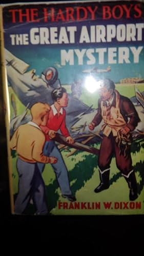 Image du vendeur pour Great Airport Mystery , HARDY BOYS #9, STATED 1ST UK EDITION, Colorful Front cover DUSTJACKET artwork by Frank Varty OF 2 Blonde & Black Haired Brothers In YELLOW & RED SWEATER WITH WHITE COLLARS & blue Pants TALKING TO MAN IN BLACK BOOTS , brown pants B mis en vente par Bluff Park Rare Books