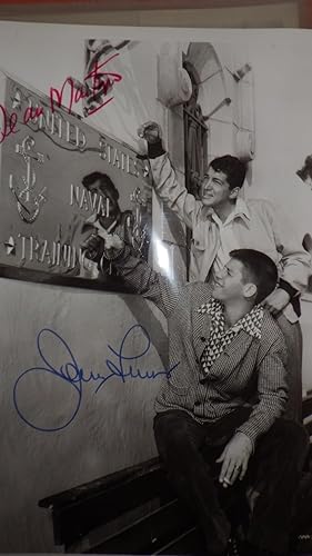 Seller image for Dean Martin & Jerry Lewis Signed B/W EARLY Photograph from Movie , Jerry seated top Bench smoking wearing Checkered Shirt & Dean Leaning on Wall by United States Naval Training Center Plaque on Side of a Building for sale by Bluff Park Rare Books