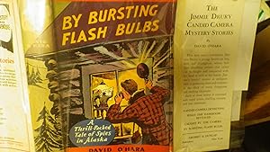 Seller image for Jimmie Drury By Bursting Flash Bulbs in RARE Color DustJacket of Jimmie At Outside Window Snapping Pics of 3 Men Inside Cabin. SERIES #4, Thrill-Packed Tale of Spies in Alaska, Jimmies Candid Camera Helps Him Gather Clues & Evidence in Thrilling Detective for sale by Bluff Park Rare Books