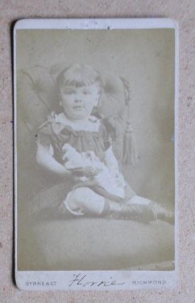 Seller image for Carte De Visite Photograph: A Studio Portrait of a Young Girl Seated on a Chair. for sale by N. G. Lawrie Books