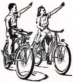Young Bicycle Riders Waving.
