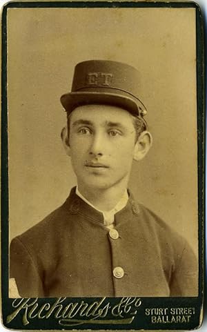 Carte de visite of young Australian man in uniform, with initials E. T. on his cap, possibly Elec...