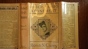 Seller image for Robert Ord's Atonement, a Novel in RARE Color Green DustJacket of Beautiful Young Ladys Face in Hat & Scarf & Stunning Paste-On Label to Taupe Cloth Hardback COVER . Popular Novel By the Prolific Ms. Carey (d.1909). for sale by Bluff Park Rare Books