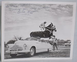 Seller image for Rodeo Hall of Famer Dick Griffith on His horse leaping Over convertible (inscribed By Dick Griffith to Oscar Strobel) for sale by Alcuin Books, ABAA/ILAB