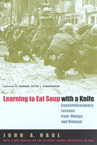 Imagen de archivo de Learning to Eat Soup with a Knife: Counterinsurgency Lessons from Malaya and Vietnam Nagl, John A. and Schoomaker, General Peter J. a la venta por Aragon Books Canada