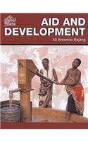 Beispielbild fr Aid and Development (The Global Village) (The Global Village S.) zum Verkauf von WeBuyBooks