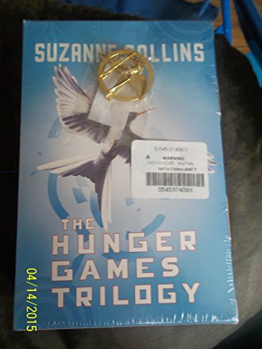 Stock image for The Hunger Games Trilogy with Pin (Hunger Games / Catching Fire / Mockingjay) for sale by Better World Books: West