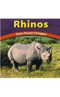 Rhinos: Horn-Faced Chargers (Wild World of Animals) (9780736809672) by Schaefer, Lola M.