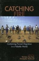 Imagen de archivo de Catching Fire: Containing Forced Migration in a Volatile World (Program in Migration and Refugee Studies) a la venta por Phatpocket Limited