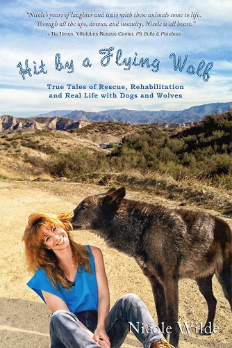 Stock image for Hit by a Flying Wolf: True Tales of Rescue, Rehabilitation and Real Life with Dogs and Wolves for sale by SecondSale