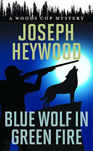 Stock image for Blue Wolf in Green Fire: A Woods Cop Mystery for sale by Half Price Books Inc.