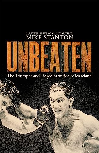 Imagen de archivo de Unbeaten: The Triumphs and Tragedies of Rocky Marciano a la venta por Front Cover Books