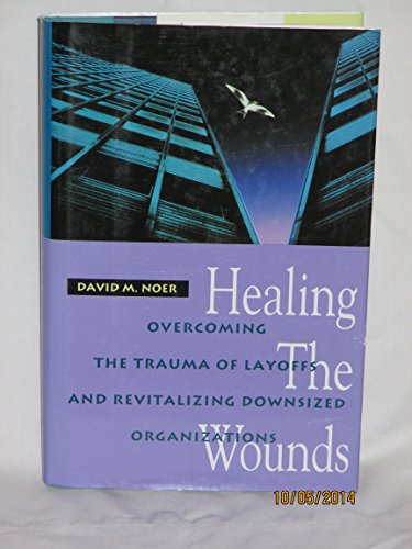 Imagen de archivo de Healing the Wounds: Overcoming the Trauma of Layoffs and Revitalizing Downsized Organizations a la venta por gigabooks