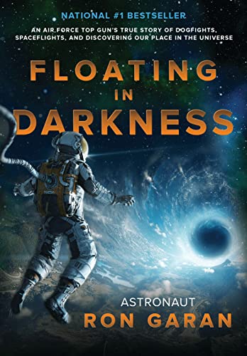 

Floating in Darkness : An Air Force Top Gun's True Story of Dogfights, Spaceflights, and Discovering Our Place in the Universe